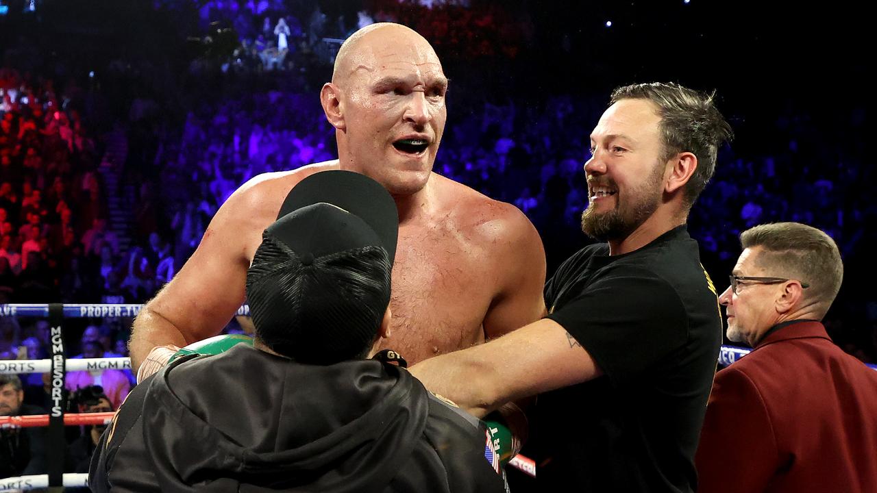 Tyson Fury celebrates his win by TKO in the seventh round against Deontay Wilder