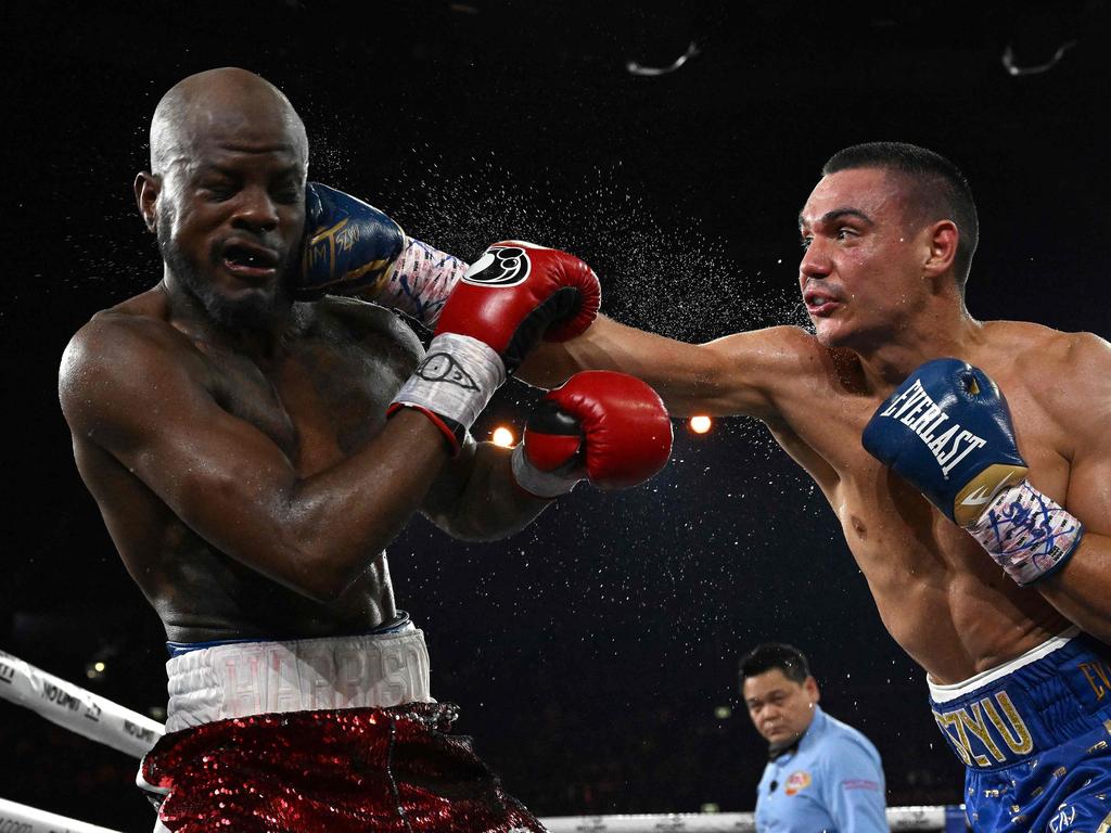 Australian boxer Tim Tszyu (R) punches USA's Tony Harrison during their WBO super welterweight world title bout. Picture: Saeed KHAN / AFP