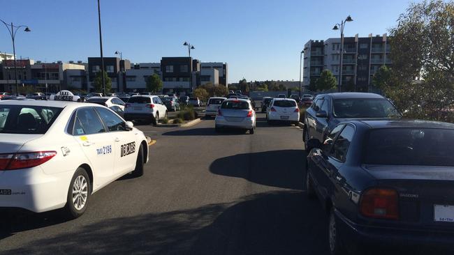 Commuters parking in non-parking areas at Mawson Lakes Interchange due to ongoing road upgrades.