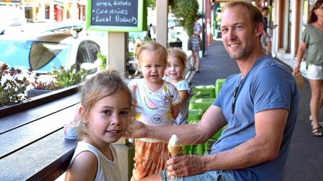 CHASING A DREAM: Guy Batters and his family on holiday from Mornington Peninsula, Victoria, enjoying an icecream in Bangalow's main street. From Left, Charlie, Penny, Asher and Guy. Mr Batters said it was his wife's dream to move to Bangalow. Picture: Karin von Behrens