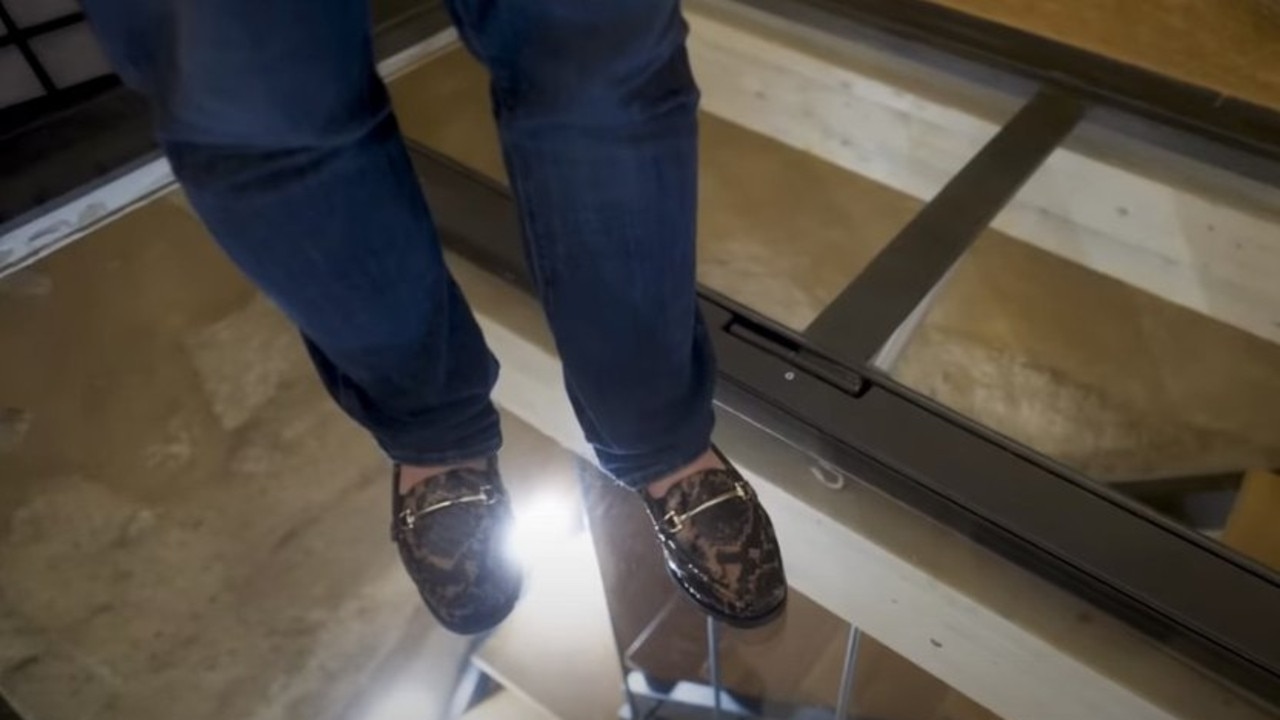 Part of the bedroom’s floor is transparent, and you can see down into the dry sauna room below. Picture: CNBC Make It/YouTube