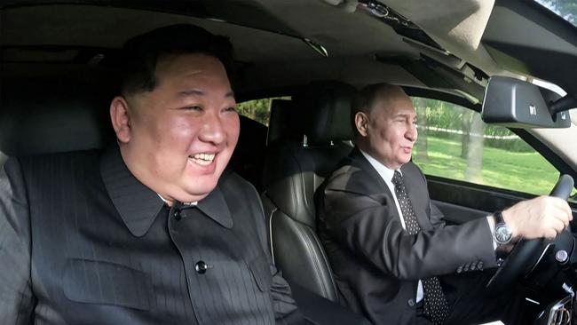 TOPSHOT - This picture taken on June 19, 2024 and released on June 20, 2024 from North Korea's official Korean Central News Agency (KCNA) via KNS shows North Korea's leader Kim Jong Un (L) sitting in the passenger seat of a car driven by Russia's President Vladimir Putin (R) in the garden of the Kumsusan State Guesthouse in Pyongyang. (Photo by KCNA VIA KNS / AFP) / South Korea OUT / ---EDITORS NOTE--- RESTRICTED TO EDITORIAL USE - MANDATORY CREDIT "AFP PHOTO/KCNA VIA KNS" - NO MARKETING NO ADVERTISING CAMPAIGNS - DISTRIBUTED AS A SERVICE TO CLIENTS THIS PICTURE WAS MADE AVAILABLE BY A THIRD PARTY. AFP CAN NOT INDEPENDENTLY VERIFY THE AUTHENTICITY, LOCATION, DATE AND CONTENT OF THIS IMAGE. /