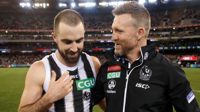 Nathan Buckley celebrates a Collingwood win with Steele Sidebottom. Picture: Getty Images