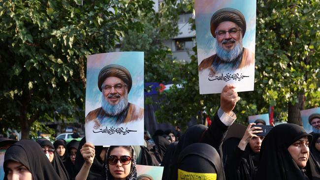 Iranian women hold pictures of Hezbollah leader Hassan Nasrallah, who was killed in an Israeli air strike on Beirut's southern suburbs, during an anti-Israel protest in Palestine Square in Tehran. Picture: AFP