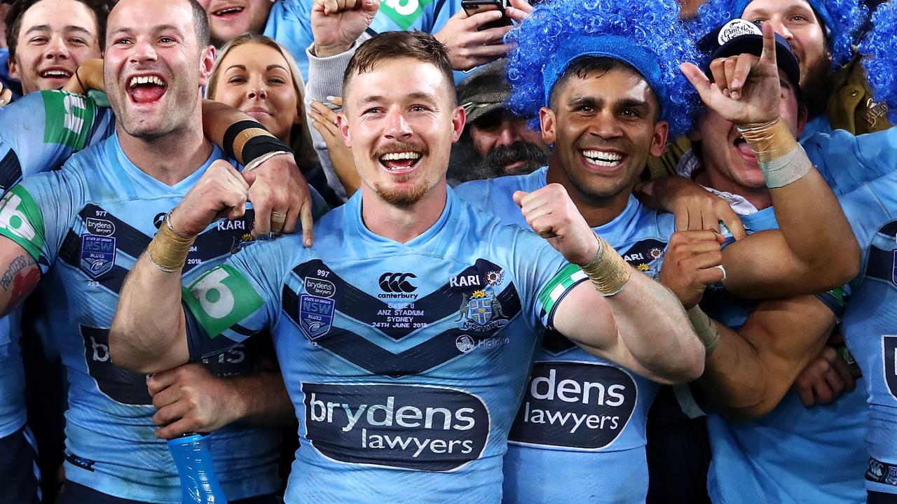 Damien Cook celebrates his first State of Origin series win with NSW Blues teammates.