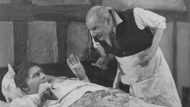 A scene from the 1926 silent film Sweeney Todd starring G.A. Baughan (right) as Todd.