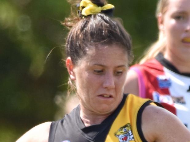 Nightcliff's Eliza Morrison in typical pose, runnign hard and kickign long. Picture: Tymunna Clement AFLNT/Media