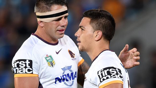 Broncos captain Corey Parker (left) congratulates Kodi Nikorima after his try.