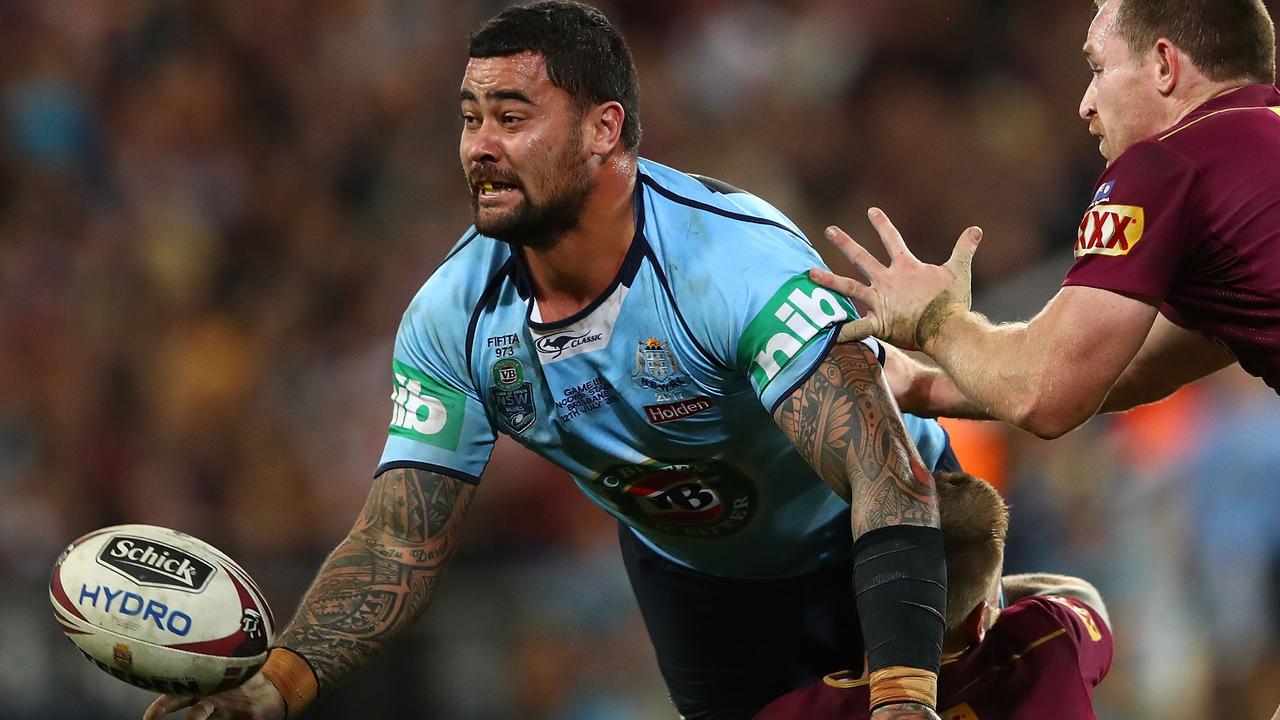 Andrew Fifita of the Blues offloads the ball.