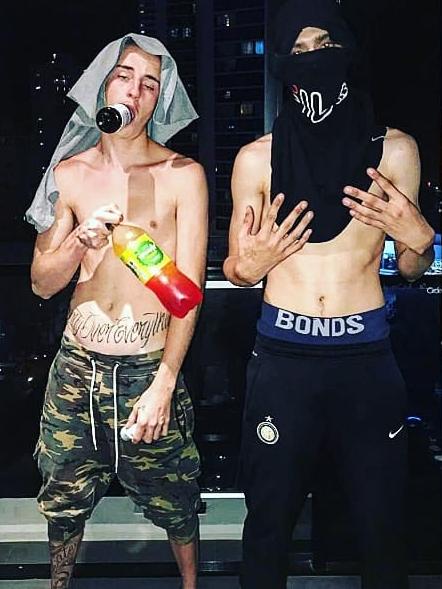 Hayden Kratzmann (right) starred in a series of amateur rap videos.