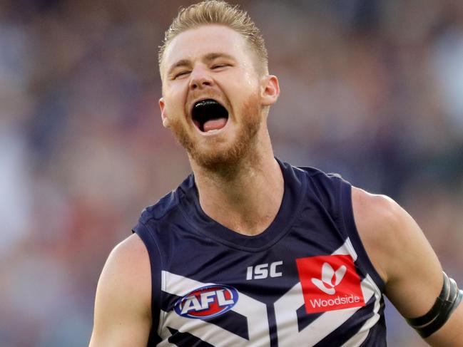 Cam McCarthy of the Dockers celebrates after kicking a goal during the Round 1 AFL match between the Fremantle Dockers and the North Melbourne Kangaroos at Optus Stadium in Perth, Sunday, March 24, 2019. (AAP Image/Richard Wainwright) NO ARCHIVING, EDITORIAL USE ONLY