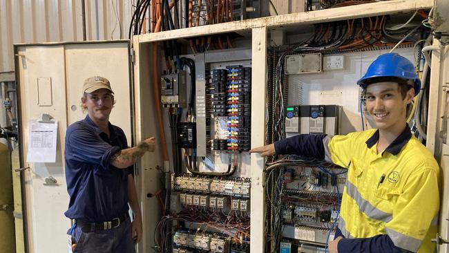 Jordan Semini and Max Hall with one of the systems they had back up and running within days of floodwaters receding.