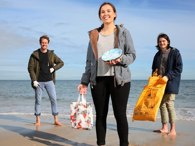 PRECIOUS PLASTIC: Lucy Dunton with Aiden Ryan, left, and Luke Christiansen at a Brighton beach clean-up with some of their products made from rubbish. Picture<b>: </b>EMMA BRASIER