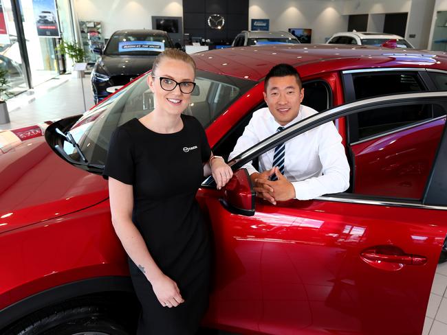 AP Eagers Auto group is merging with an interstate Dealership to become the largest in the Country, pictured is Kirstie Michalak (Finance Specialist) and Bo Kiss (sales consultant) at Eagers Newstead, Newstead Friday 5th April 2019 Picture AAP/David Clark