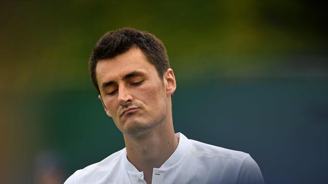 Australia's Bernard Tomic reacts during his first-round loss to Germany's Mischa Zverev.