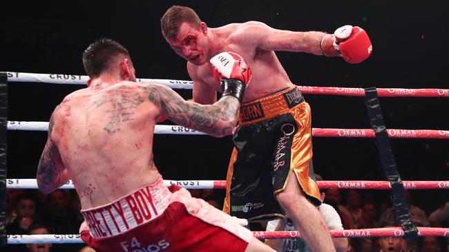 A bloody Jeff Horn knocks down Michael Zerafa during their middleweight bout in Brisbane. Picture: Getty Images