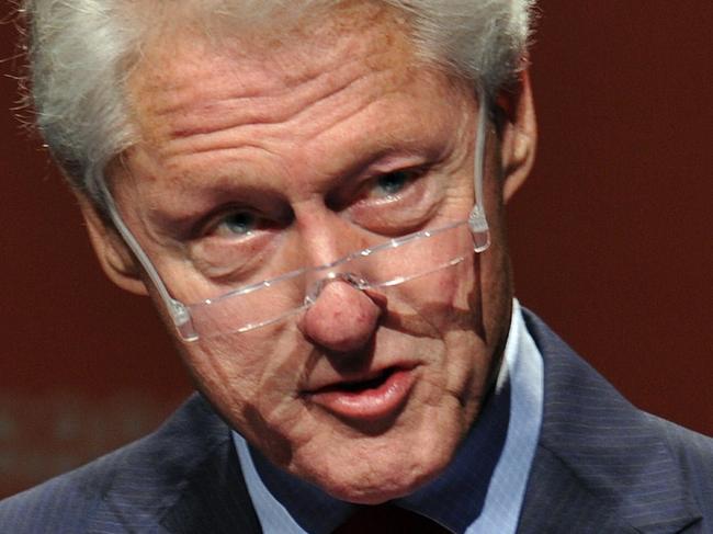 Former US president Bill Clinton addresses the 2014 AIDS Conference at the Melbourne Convention and Exhibition Centre (MCEC) in Melbourne on July 23, 2014. Clinton called for strength in responding to the downing of Malaysia Airlines flight MH17, declaring that those who shot down the plane -- and provided the means to do it -- sided with a brutal vision of the world. AFP PHOTO / ESTHER LIM
