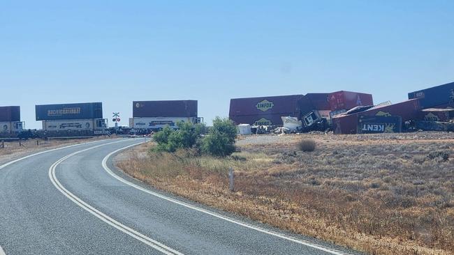 The impact caused the train to catch fire and several carriages to derail, blocking the entire highway. Picture: ABC