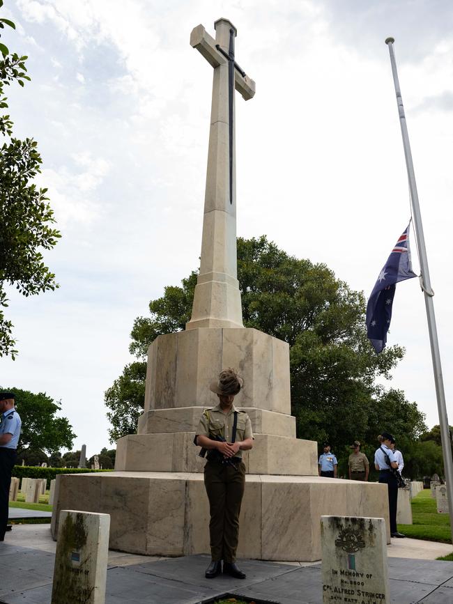 Members of the Catafalque party stood vigil beneath the Cross of Sacrifice. Picture: Morgan Sette