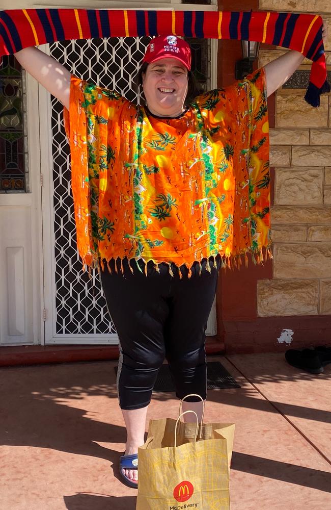 Adelaide United's head of commercial Adam Thompson and communications chief Marius Zanin have delivered packs to some of the club's longest-serving season ticket holders including Sonia Di Pardo. Picture: Adelaide United