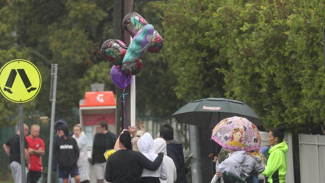 Flowers and balloons were laid at the crash site on Rooty Hill Road North in Plumpton. Picture: John Grainger