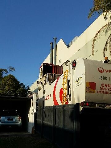 A rubbish truck uses the 2.6m-wide laneway on East St. It passes just centimetres from the fence. Supplied by Shelley Threfall.