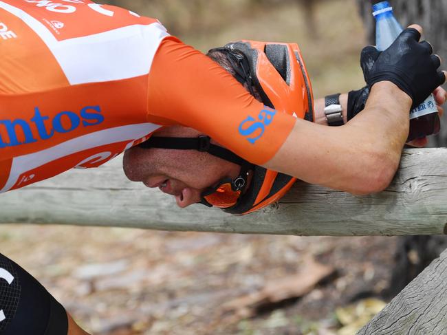 A dejected Patrick Bevin is seen after stage four of the Tour Down Under from Unley to Campbelltown in South Australia, Friday, January 18, 2019. (AAP Image/David Mariuz) NO ARCHIVING, EDITORIAL USE ONLY