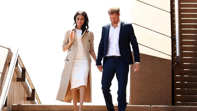 High alert, high spirits, happy royals: Prince Harry, Duke of Sussex and Meghan, Duchess of Sussex (L) arrive at the Sydney Opera House. Picture: Mark Metcalfe/Getty