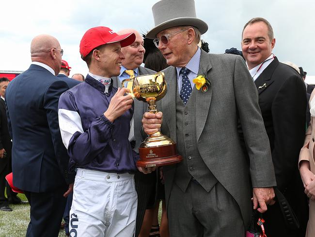 Jockey and owner celebrate a well-deserved win.