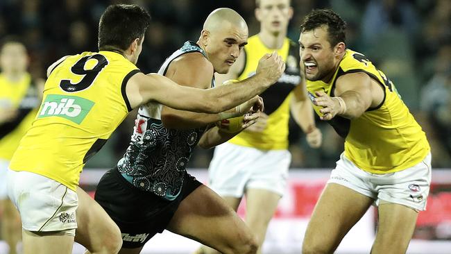 Sam Powell-Pepper tries to get through Trent Cotchin and Toby Nankervis. Picture: Sarah Reed