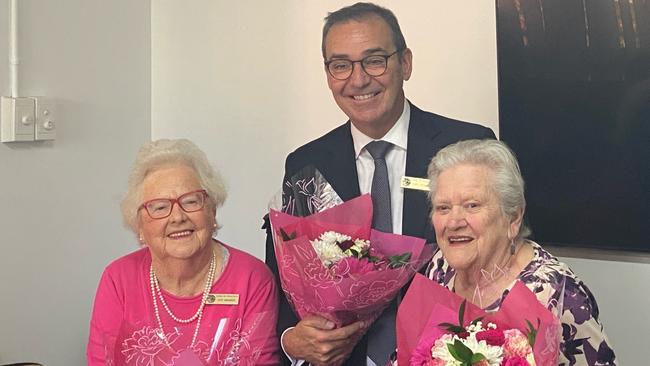 Former SA Premier Steven Marshall presenting flowers to constituents in his seat of Dunstan.