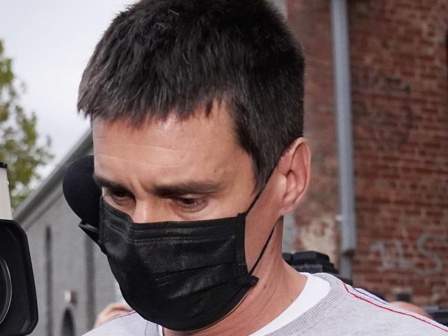 Richard Pusey, the driver of a Porsche who allegedly fled the scene of a truck crash on Melbourne's Eastern Freeway which killed four police officers, is taken away from his Fitzroy property by police in Melbourne, Thursday, April 23, 2020. (AAP Image/Michael Dodge) NO ARCHIVING