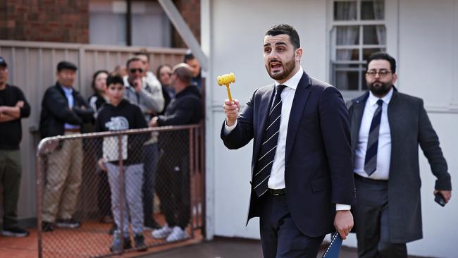 Auctioneer Alex Pattaro drops the gavel on a home at 27 Scott St in Belfield. Picture: Sam Ruttyn