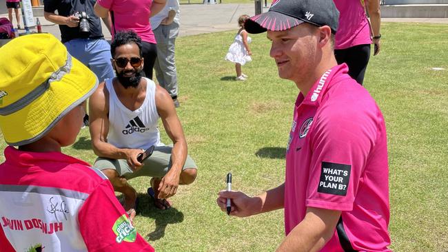 Josh Philippe signing cricket bats outside Ce.x Stadium. Picture: Matt Gazy