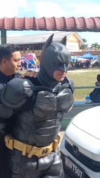 Bizarre moment Batman is arrested during children's party