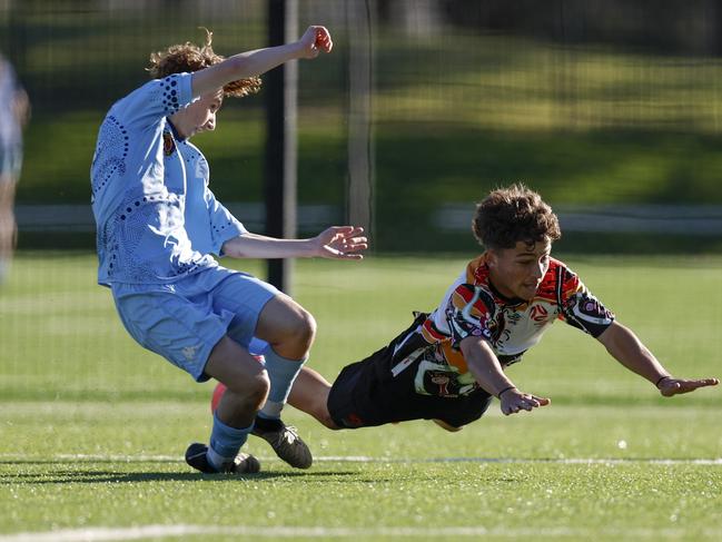 Chase McFadyen can't keep his feet. Picture: Michael Gorton. U16 Boys NAIDOC Cup at Lake Macquarie Regional Football Facility.