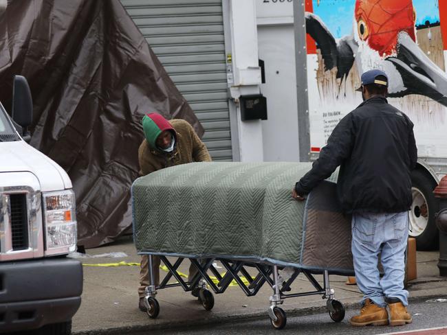 A coffin is taken into the Andrew Cleckley Funeral Home in Brooklyn. Picture: Getty Images/AFP