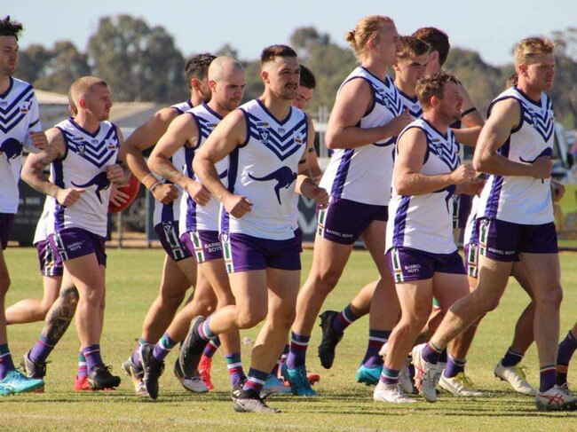 Cohuna Football Netball Club run out on to the field earlier this season. Picture: Cohuna Football Netball Club.