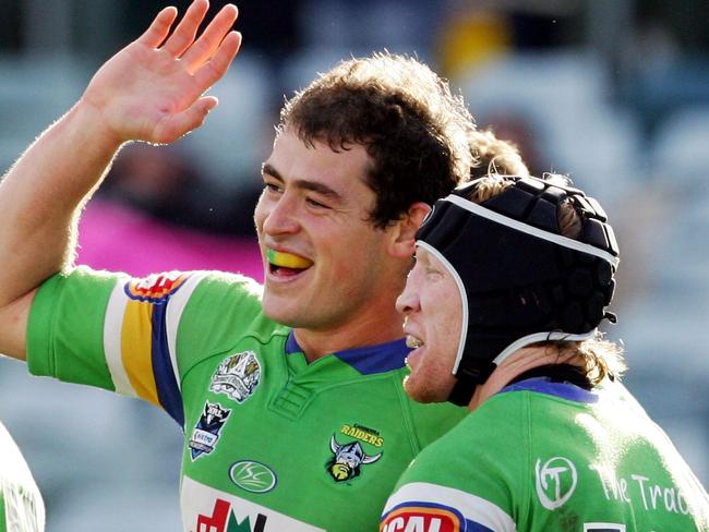 Terry Campese celebrates another try with captain Alan Tongue (13) during Canberra Raiders v Penrith Panthers NRL match at Canberra Stadium in Canberra.