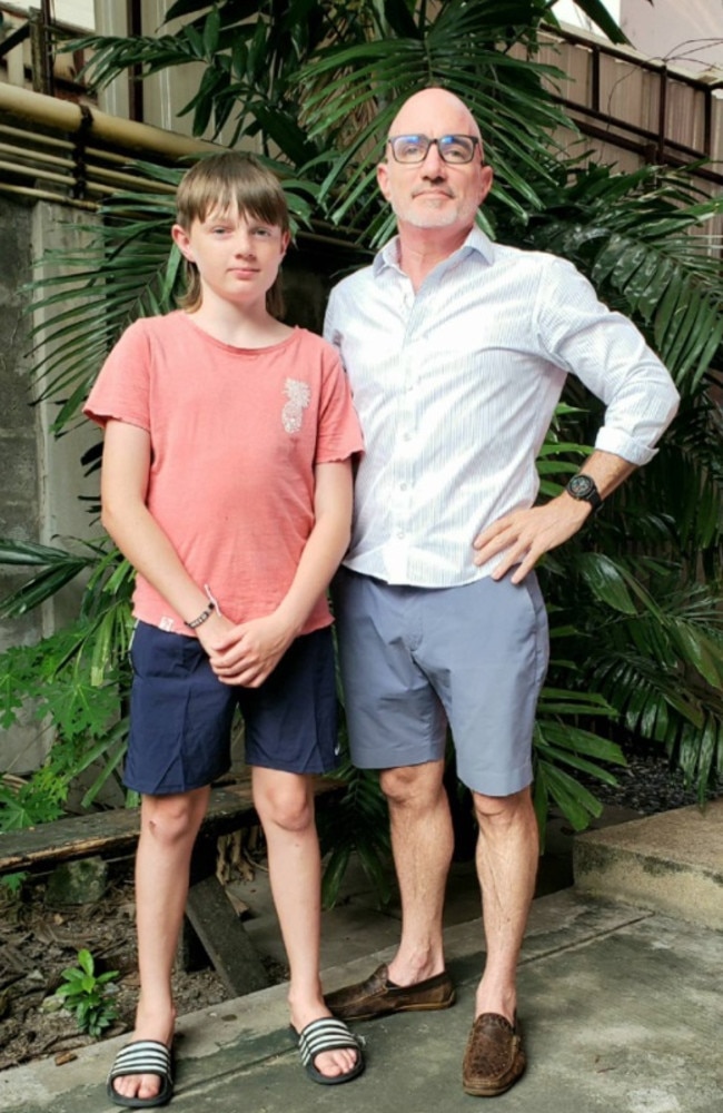 Charlie, 12, and Andrew Read have been reunited in Bangkok but only after new flights were purchased with a different airline. Picture: New Zealand Herald