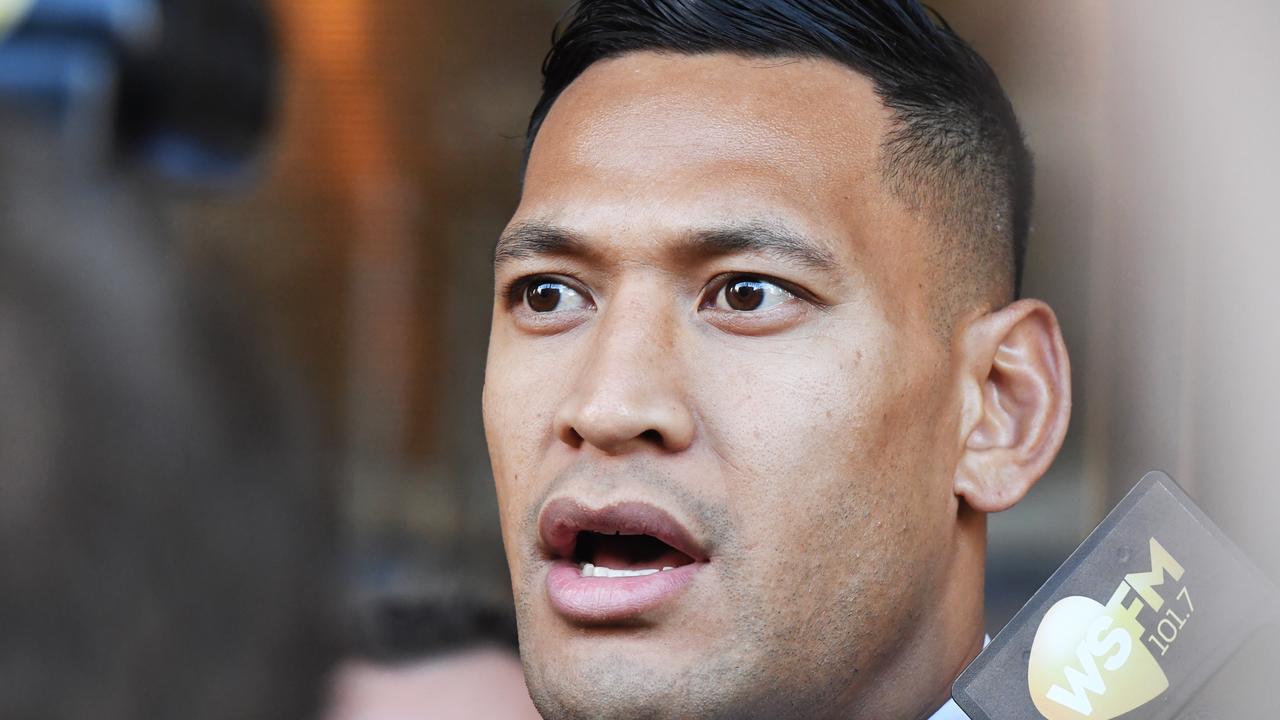 Israel Folau leaves a conciliation hearing at the Fair Work Commission in Sydney.