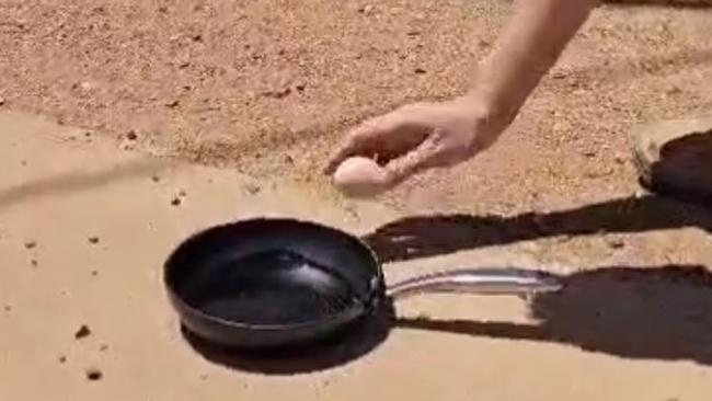 Frying an egg in 48.1 degrees in Oodnadatta , South Australia . Picture: The Pink Roadhouse