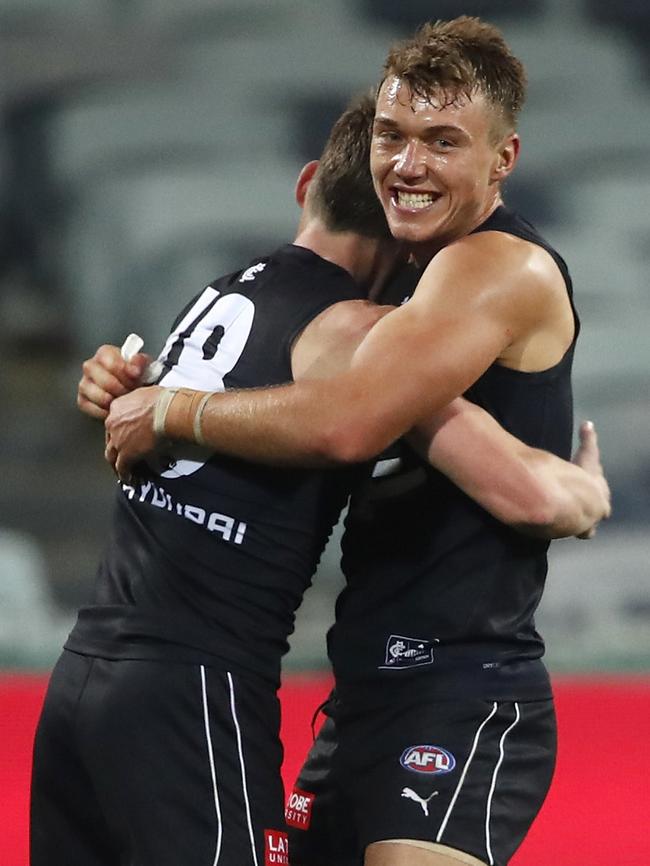 Carlton’s Patrick Cripps and Sam Walsh enjoy their side’s victory.