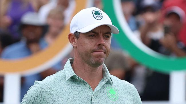 Ireland's Rory McIlroy looks on as he arrives for round 3 of the menâs golf individual stroke play of the Paris 2024 Olympic Games at Le Golf National in Guyancourt, south-west of Paris on August 3, 2024. (Photo by Emmanuel DUNAND / AFP)