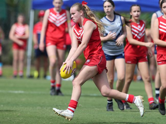 AFLQ SEQ Schools Cup semi-finals at Metricon Stadium. Palm Beach Currumbin (red) V Varsity Lakes in Junior Female Division. PBC player Alannah Welsh dominated the game. Picture: Glenn Hampson