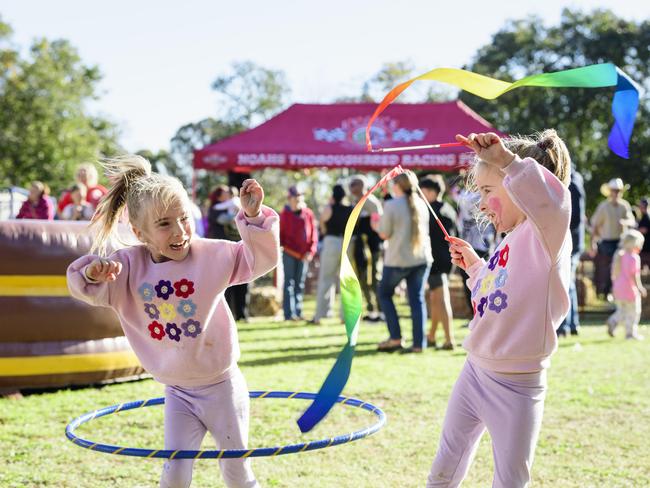 Madison (left) and Lexi Wilkinson at Sadie's Day Out, a special community event to celebrate the life of five-year-old crash victim Sadie, held at Cambooya State School, Saturday, June 7, 2025. Picture: Kevin Farmer