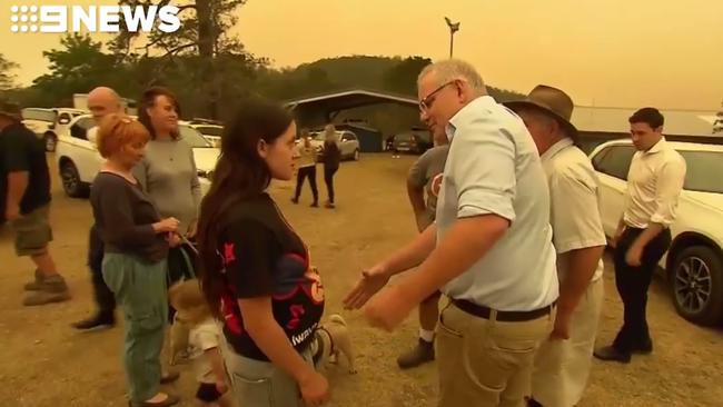 Scott Morrison is confronted by an angry local at Cobargo early in the new year. Picture: 9 News