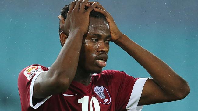 Mohammed Muntari of Qatar reacts after a missed chance at goal.