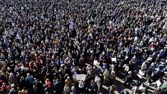 People gather on Place du Capitole in Toulouse in homage to Paty two days after he was beheaded. Picture: AFP