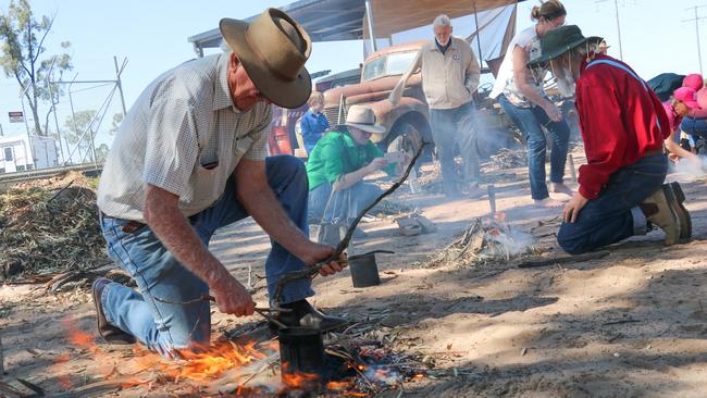 David McDonald and Howard Hawke boiling their billies at the Miles Historical Village as part of the Back to the Bush Festival.